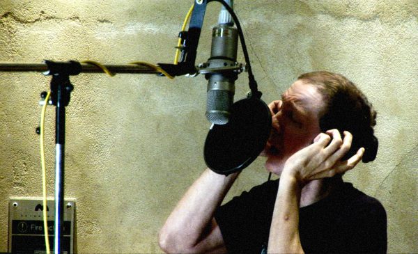 Scott Walker singing into microphone (colour)